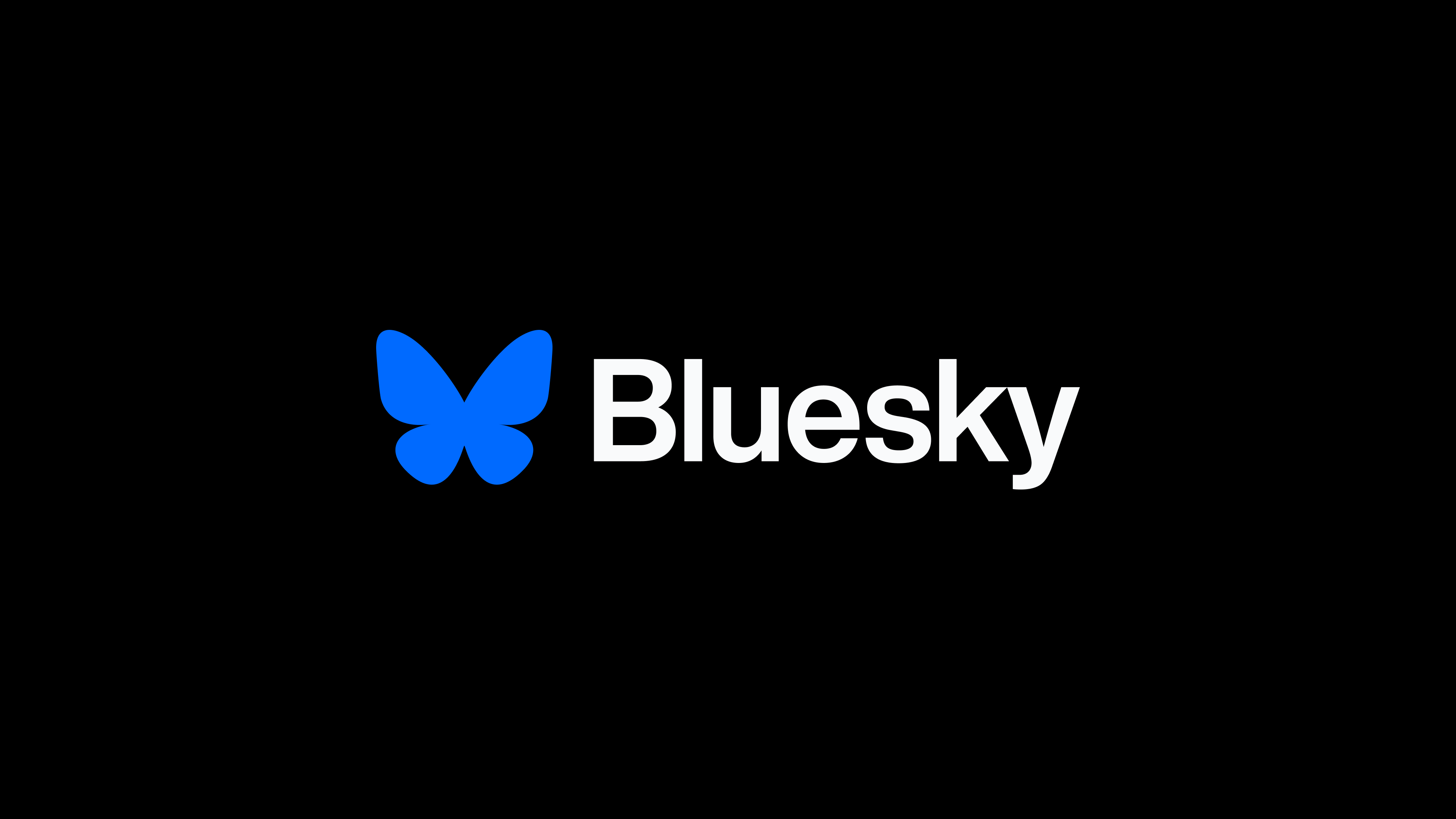 Bluesky banner: blue + white on black
